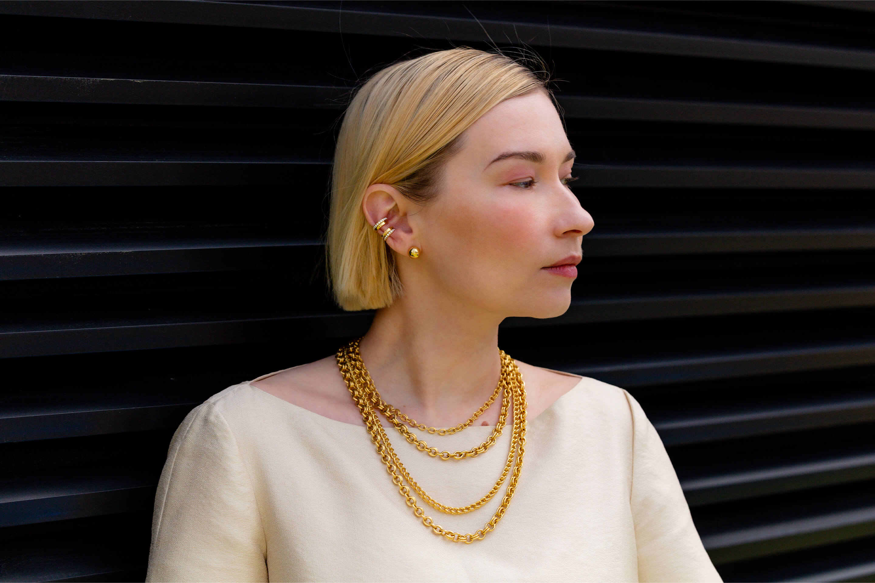 Natalia Zemliakova is wearing Auvere 22 and 24 karat gold jewelry