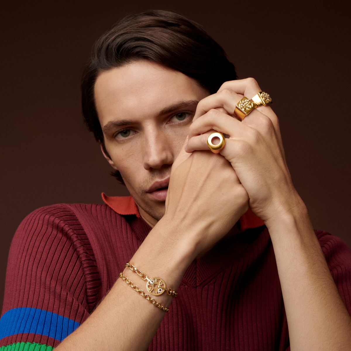 Model wearing gold jewelry for styles by generation