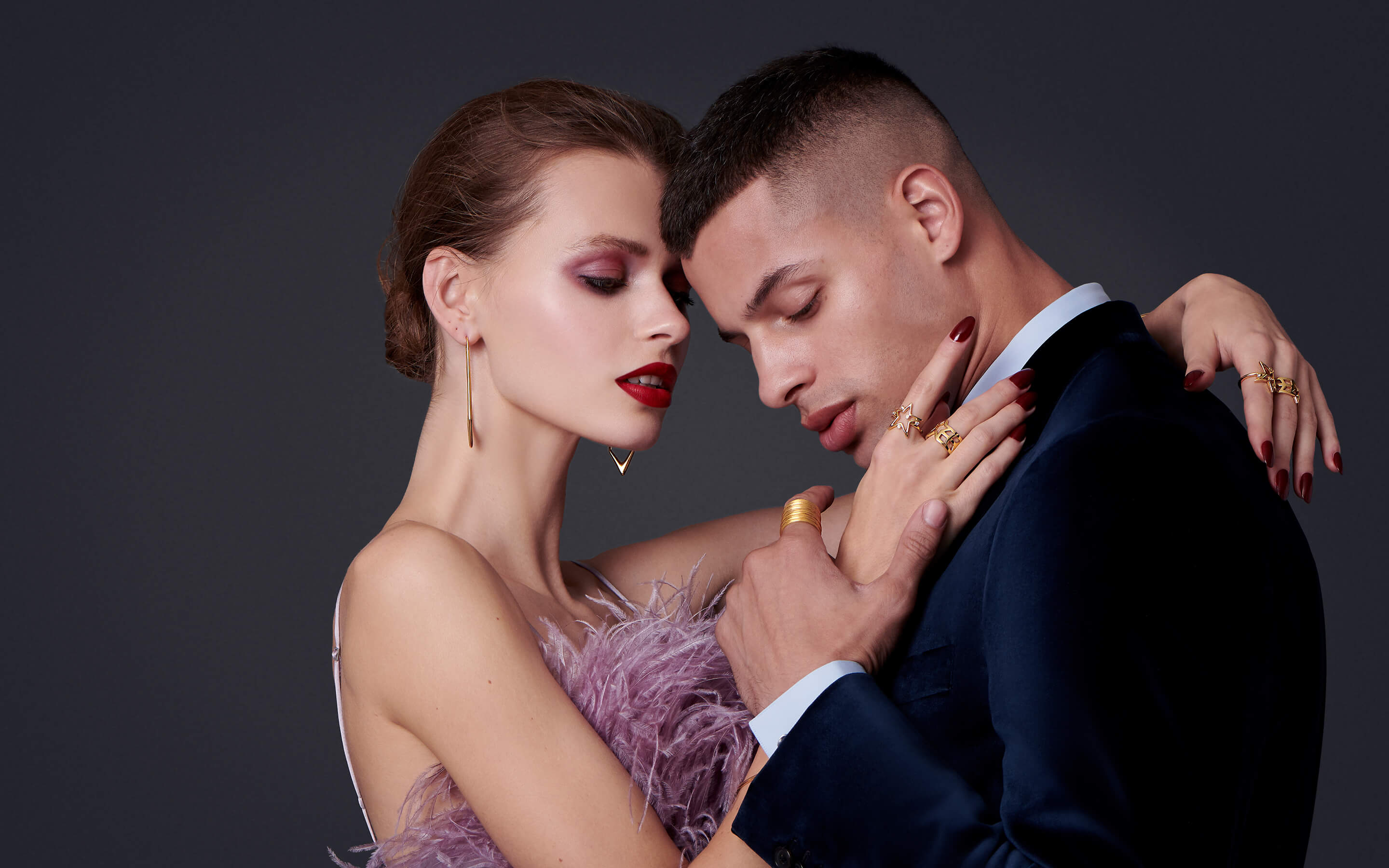 Male and woman models wearing Auvere 22 and 24 karat gold jewelry from the Gold Complex campaign