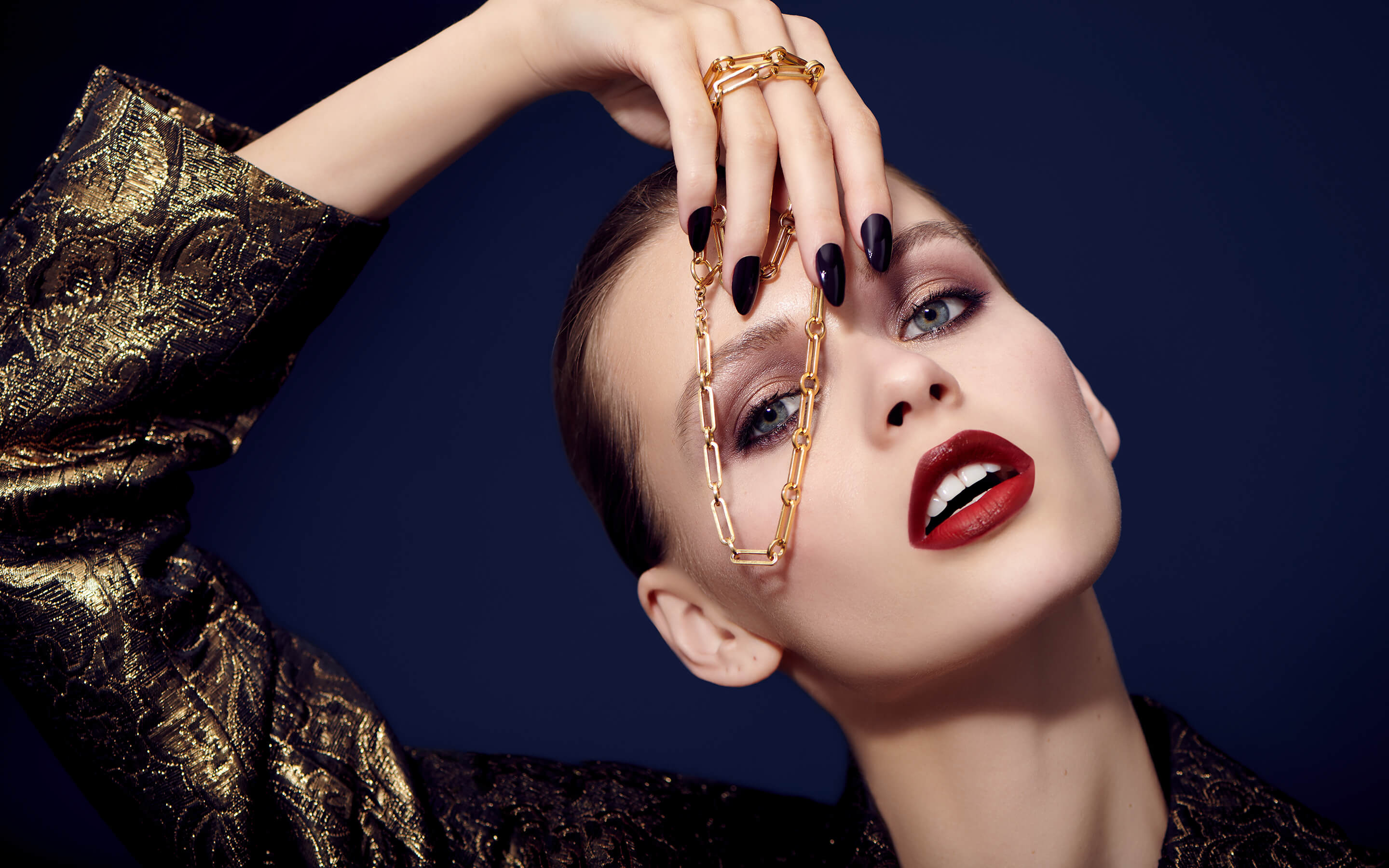 Woman model wearing Auvere 22 and 24 karat gold jewelry from the Gold Complex campaign