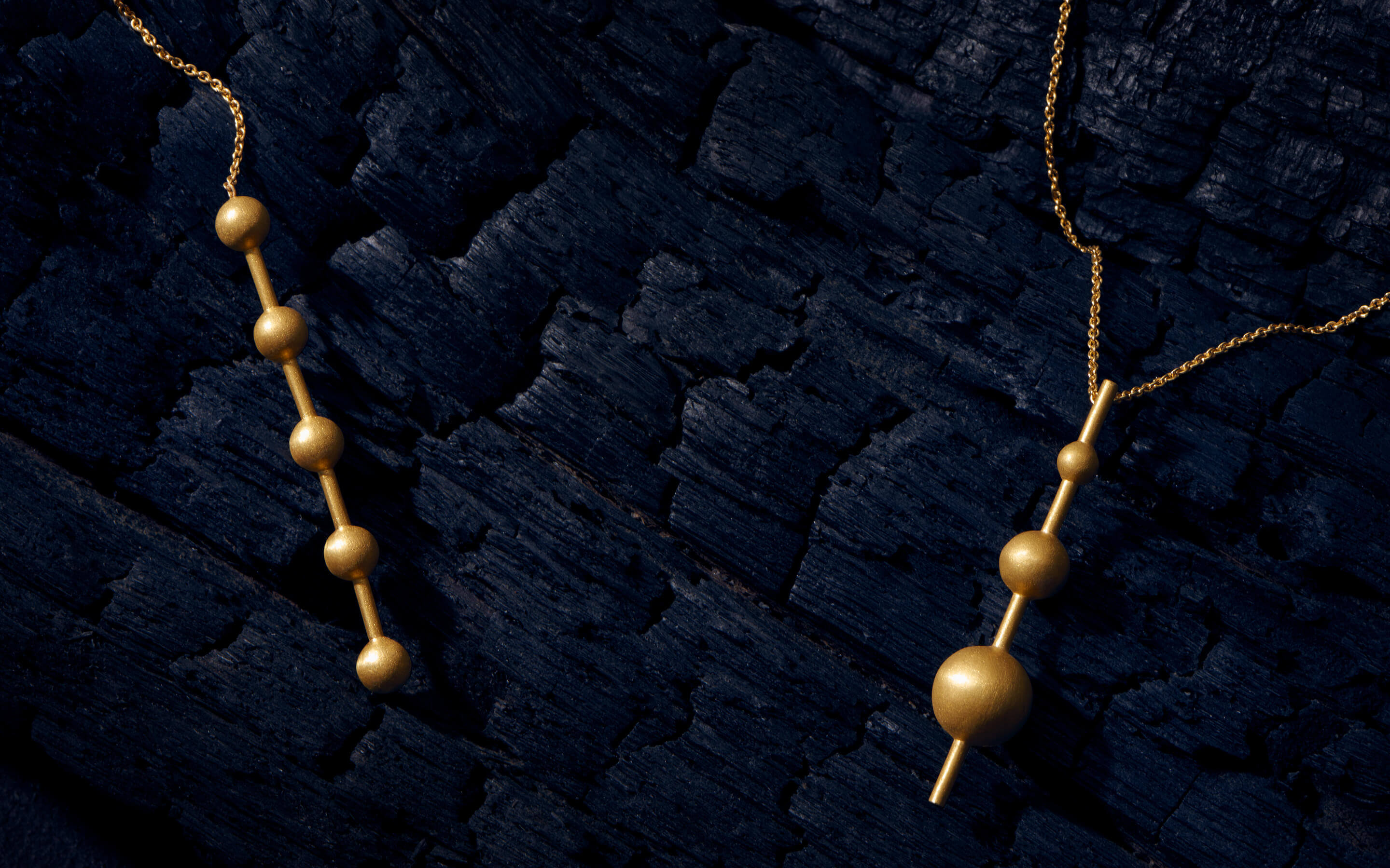 Auvere 22 and 24 karat gold jewelry from the Cosmic Gold campaign