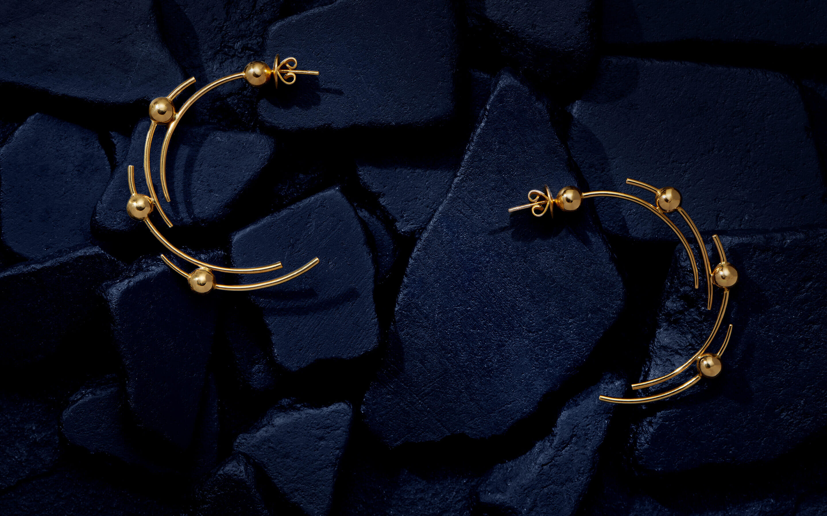 Auvere 22 and 24 karat gold jewelry from the Cosmic Gold campaign