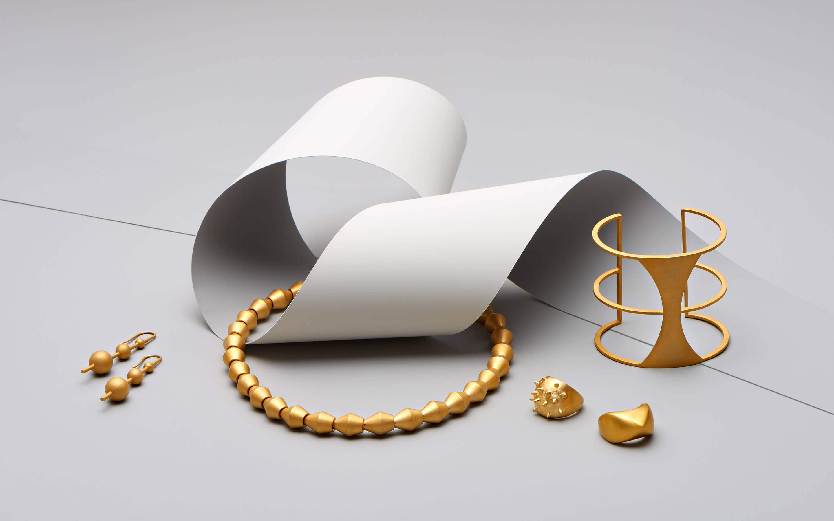 Auvere 22 and 24 karat gold jewelry from the Gold Play campaign